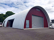 Arch building with side opening